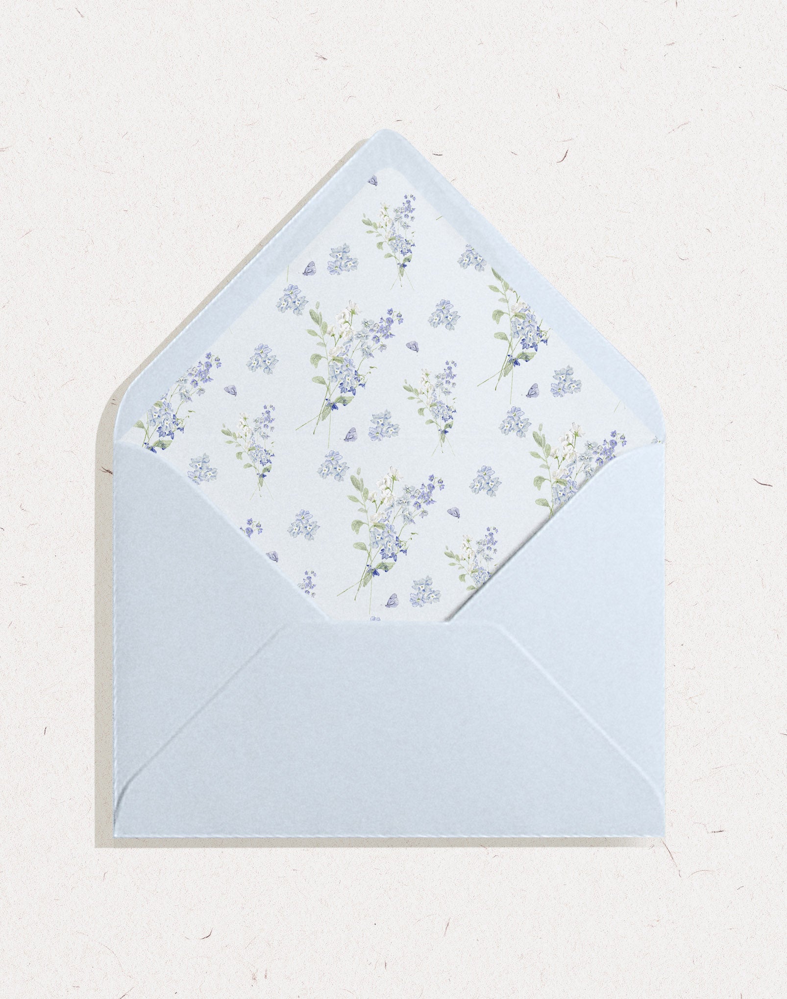 Light sky blue wedding envelope with envelope liner featuring blue flower delphinium pattern
