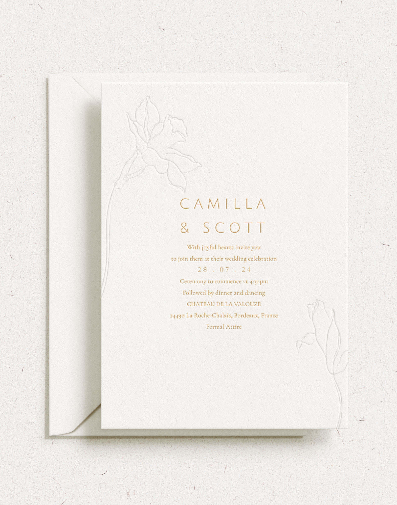 Luxury customisable wedding invitation shown with gold foil, floral debossed elements and white envelope