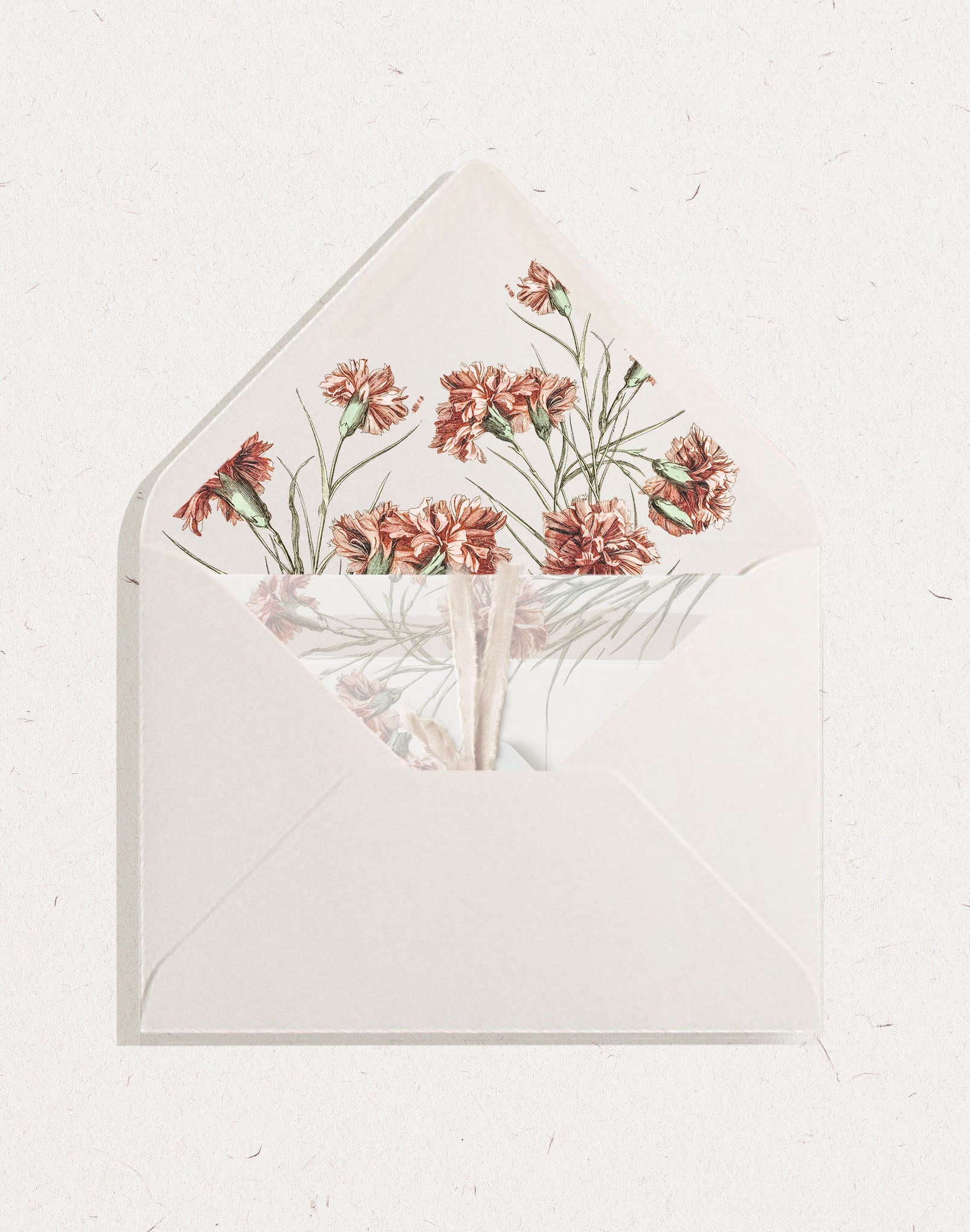 White wedding envelope featuring an invitation suite and envelope liner with vintage red carnation flowers