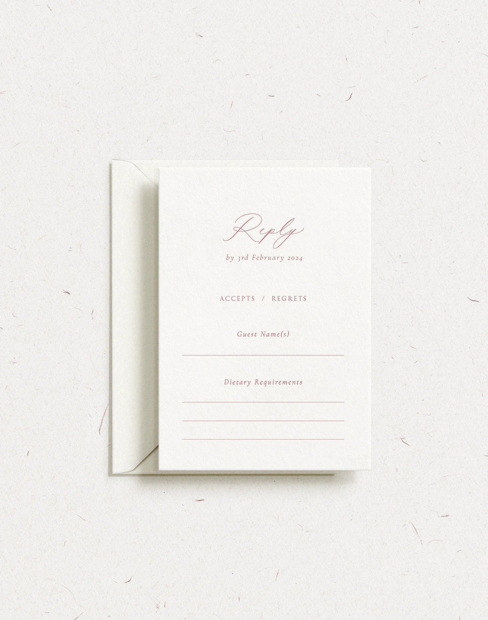 Luxury customisable wedding postal rsvp card shown with dusky rose letterpress and envelope