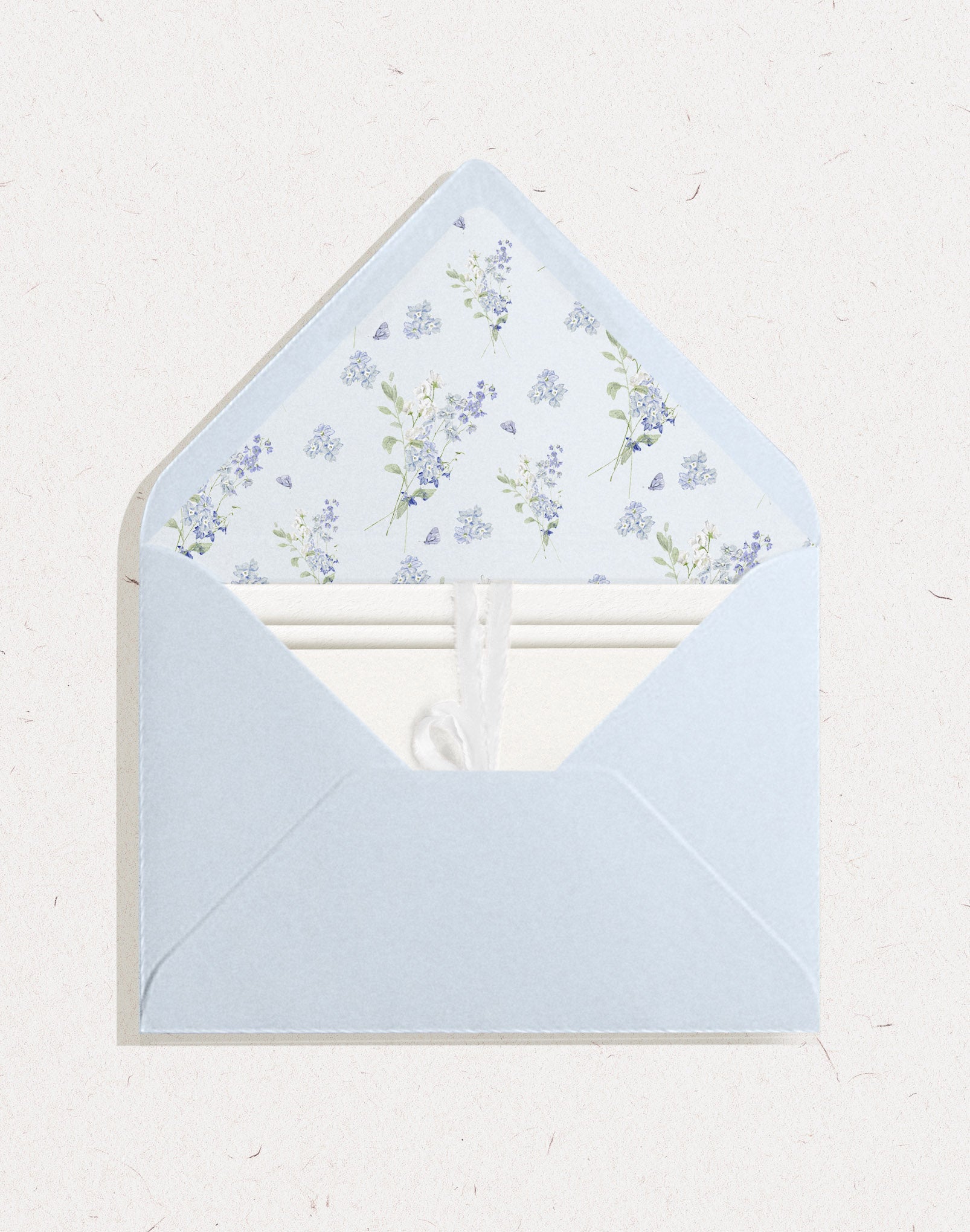Light sky blue wedding envelope featuring an invitation suite and envelope liner with blue flower delphinium pattern