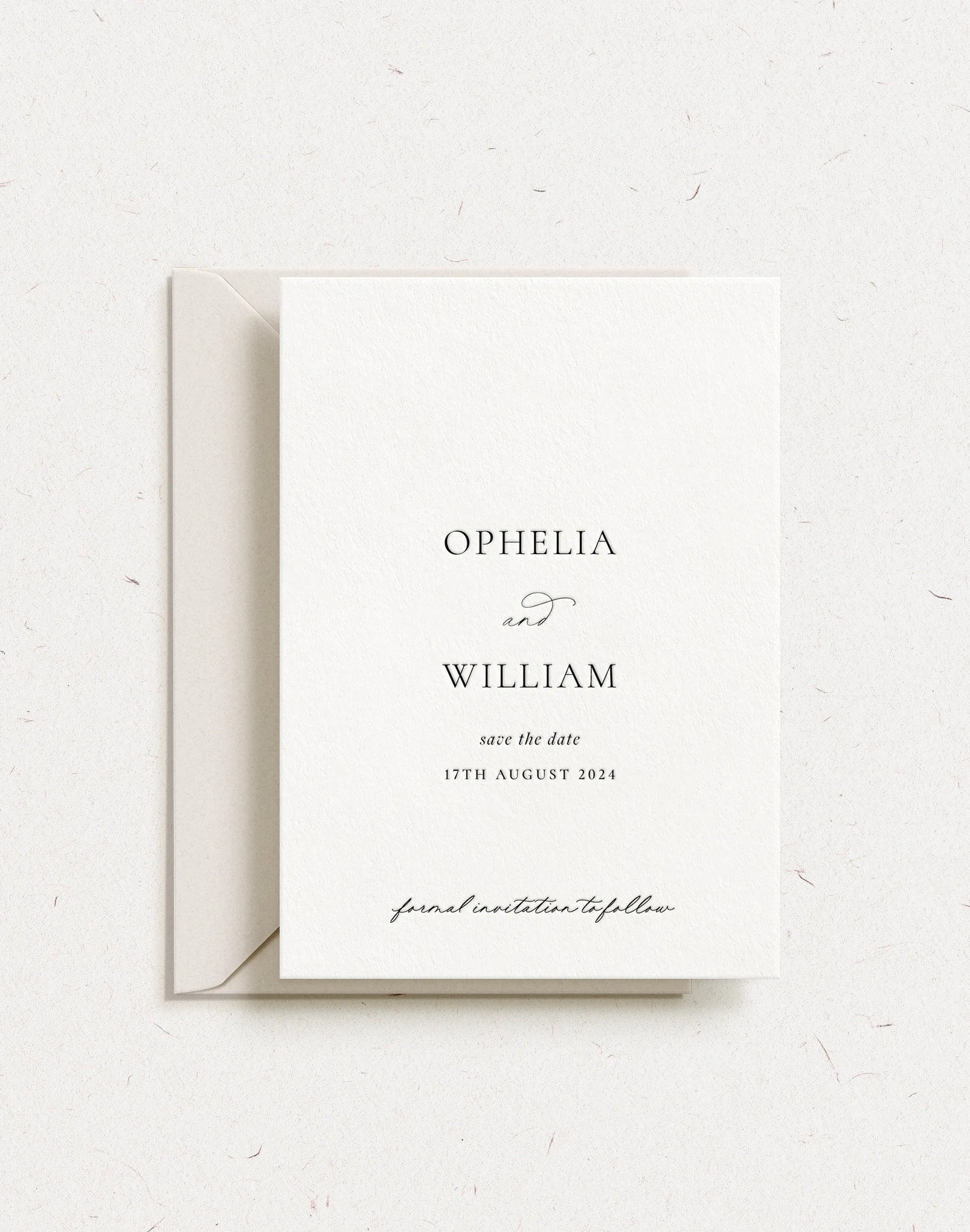 Luxury customisable save the date shown with black letterpress and almond envelope