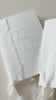 Video showing handmade speech books made from white cotton card, bound with white silk ribbon with the words 'words from the heart' embossed on the front cover. Perfect for wedding speeches, ceremony readings or love letters.
